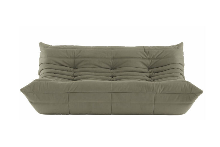 A Ligne Roset Togo Sofa, an iconic low-profile quilted seating piece.