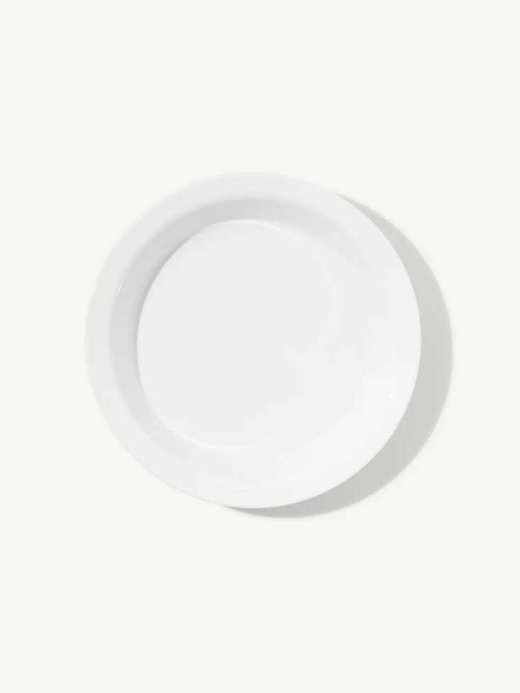 A sleek white porcelain pie dish by Made In.