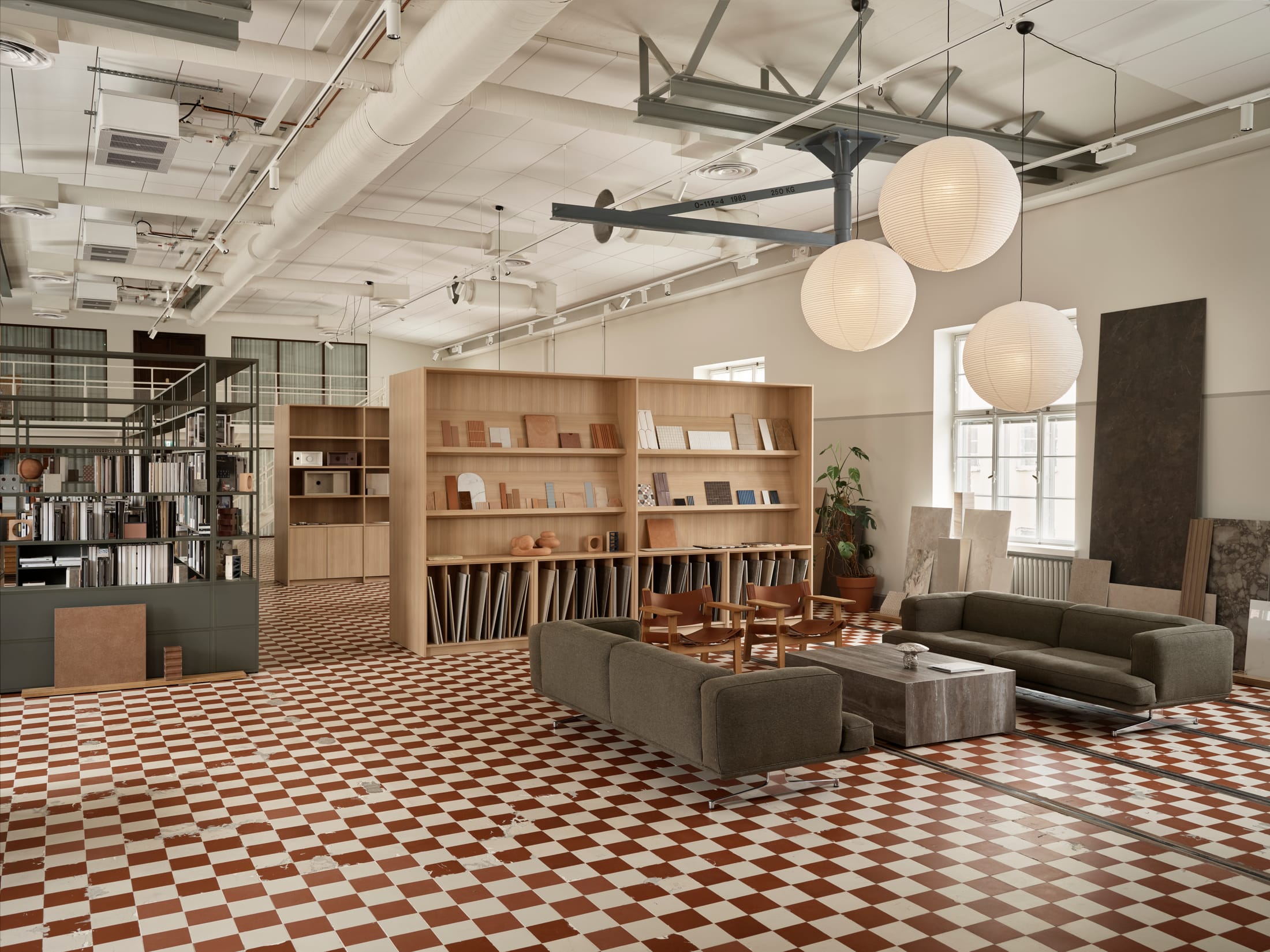 A stylish office hallway in Konelabra showing the mix of brickwork and modern glass partitions.