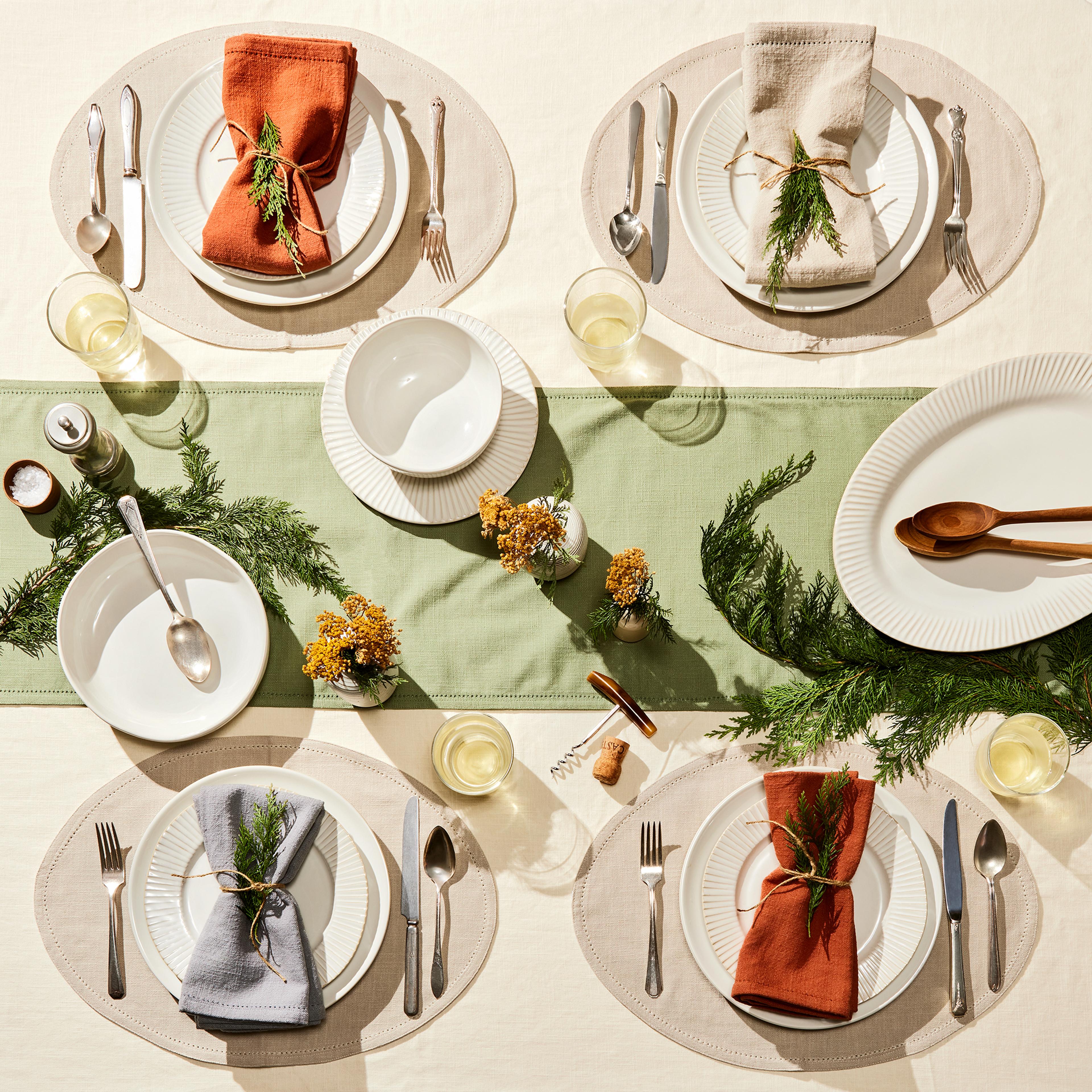 A table setting featuring sienna, sage, and cream colors.