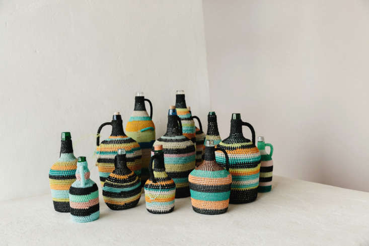 Glass bottles encased in colorful traditional Portuguese nautical crochet.