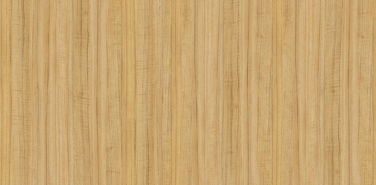 Close-up macro shot of dark teak wood grain and natural patterns