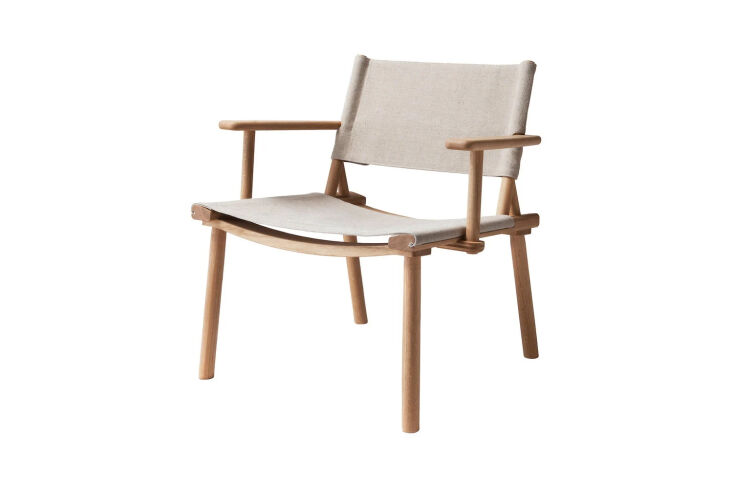 The Nikari December Lounge Chair with an oak frame and linen canvas upholstery.