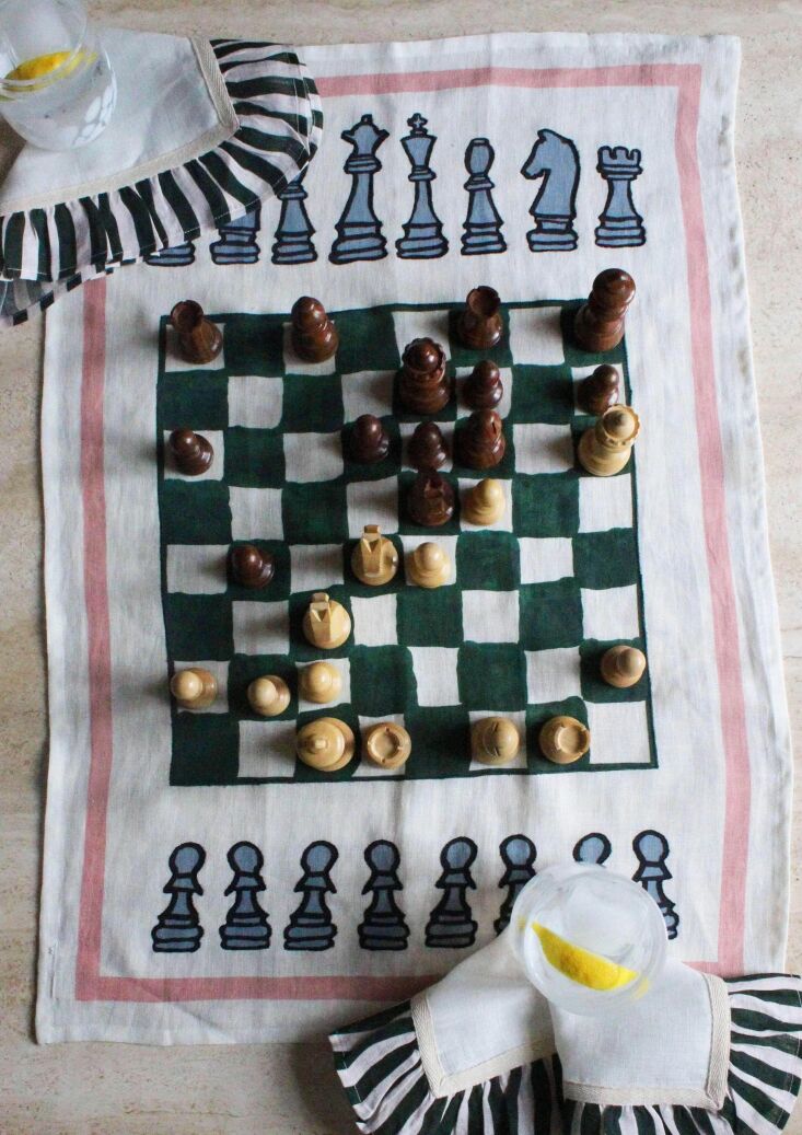 A decorative chess tea towel with an artistic hand-drawn aesthetic.