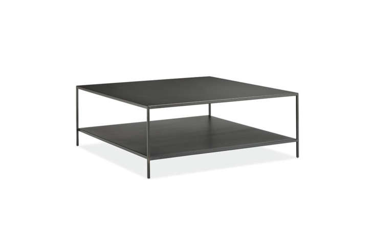 Minimalist rectangular coffee table with a slim natural steel frame.