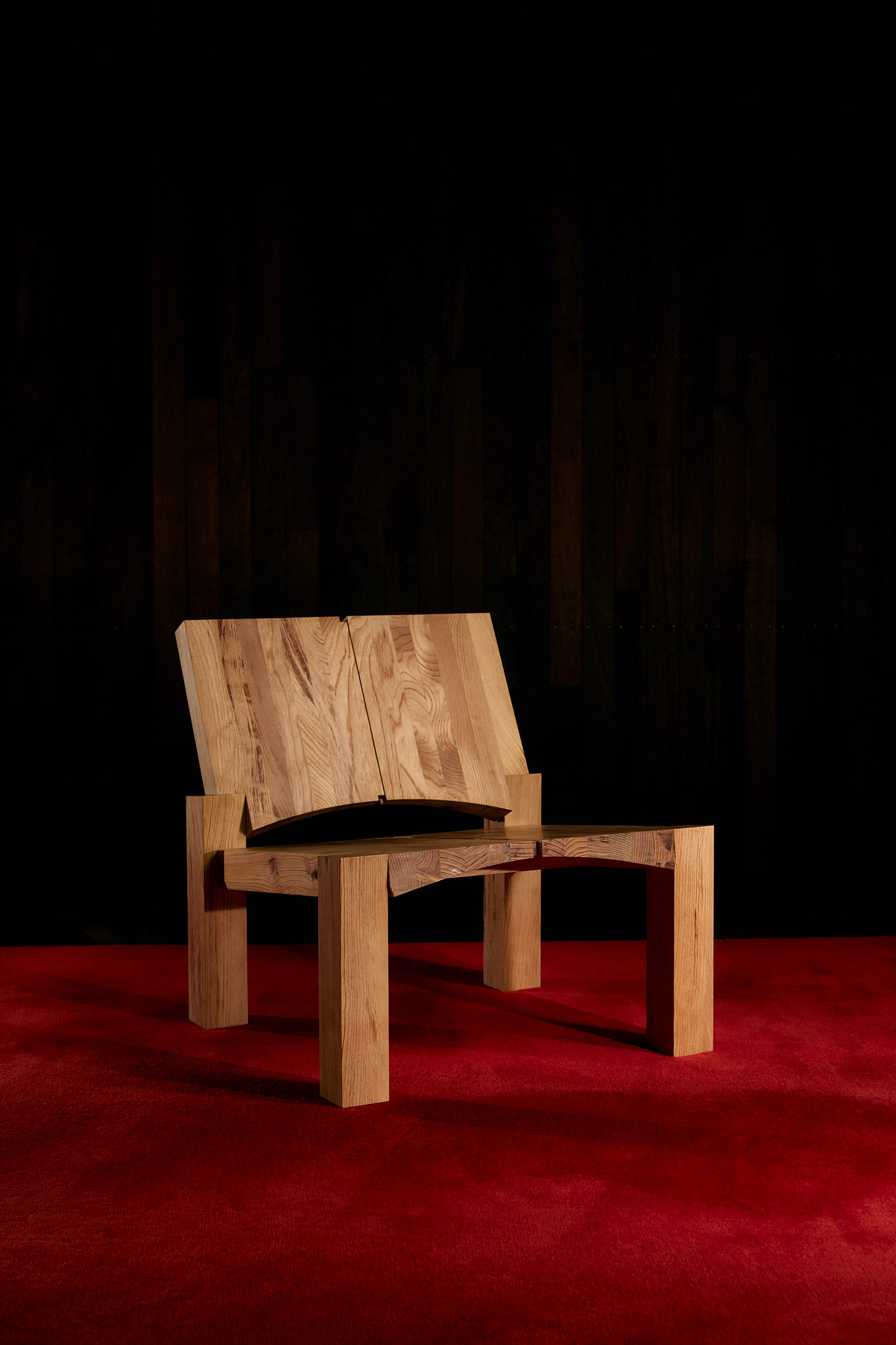 Full view of the Knot Pine chair showcasing its unique wood grain and modernist geometry.