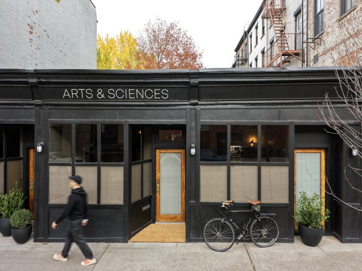 The exterior of the building painted in a sophisticated all-black finish.
