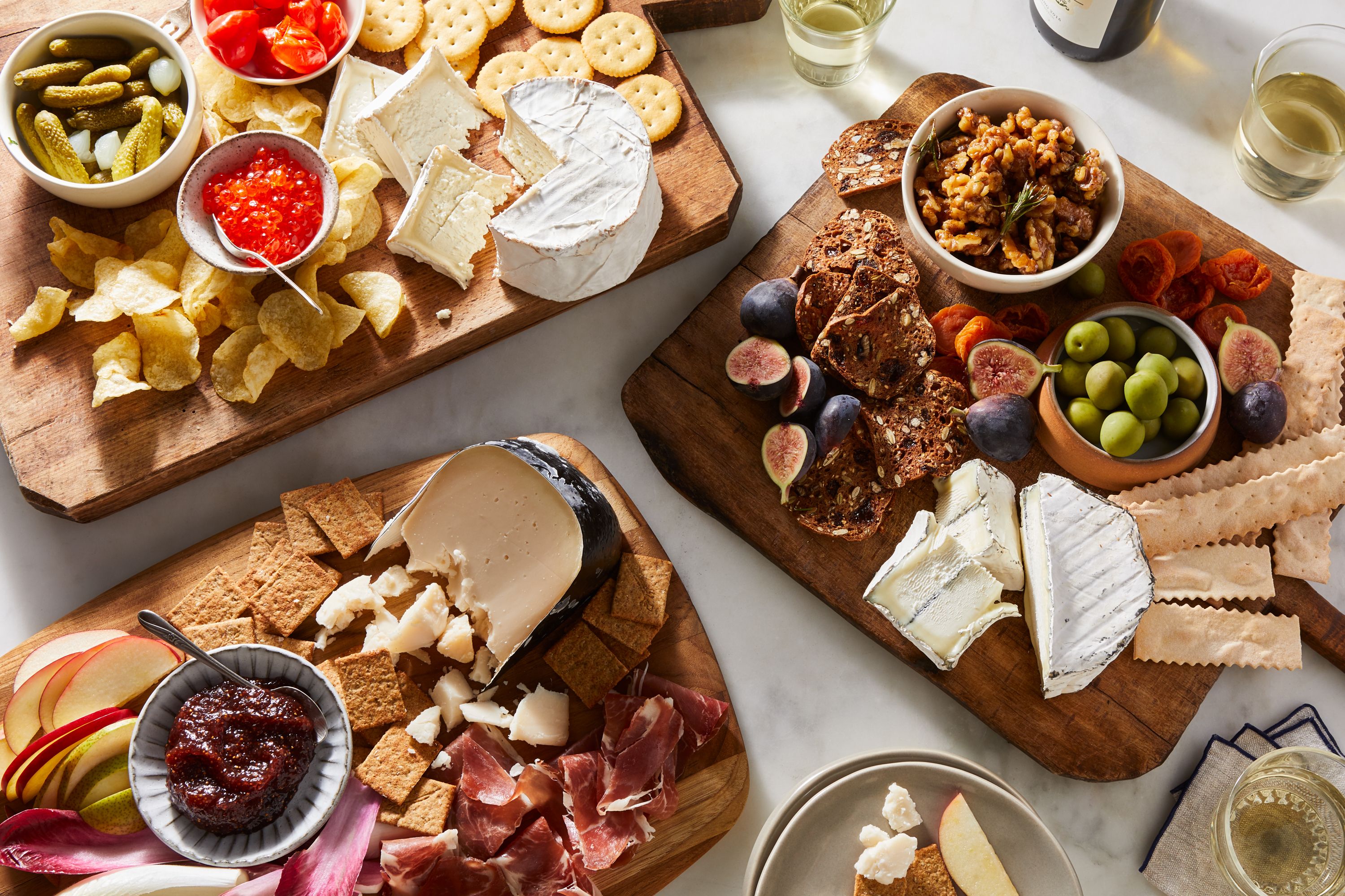 A close-up of the Stanley Tucci Holiday Cheese Tower on a festive serving platter.