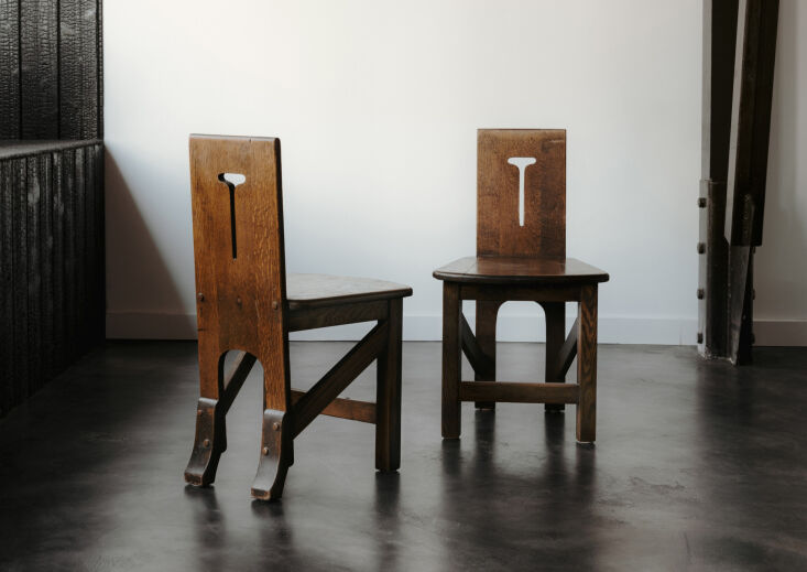A pair of sophisticated vintage Tyrolean chairs with dark wood finishes from The Future Perfect.