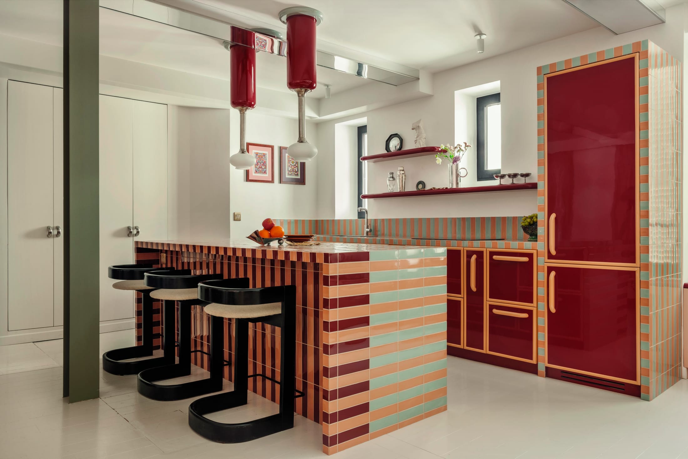 A bright, open-plan view of the Atelier HA Pigalle apartment showing the integration of living and dining areas.