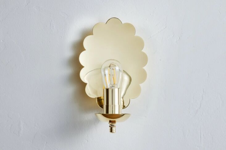 The Nickey Kehoe Scallop Sconce showcased against a minimalist background.