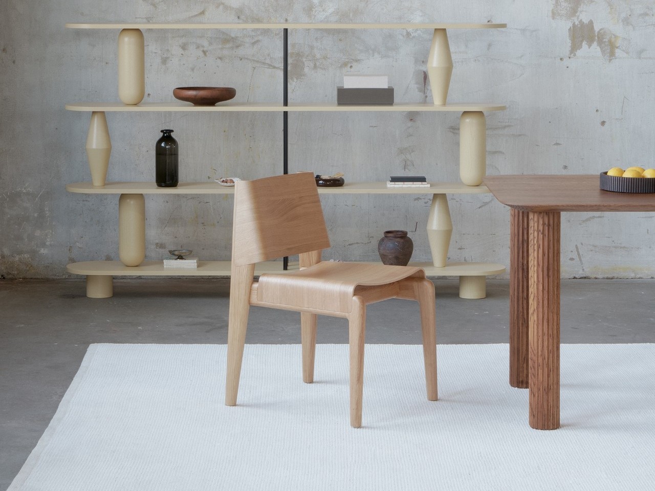 Graphic text reading 'Undia: A Chair Shaped by the Rhythm of a Wave' against a clean background.