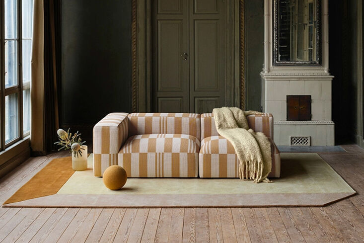 Layered Rosso 3-Seat Sofa in a bold beige and white checkerboard pattern.