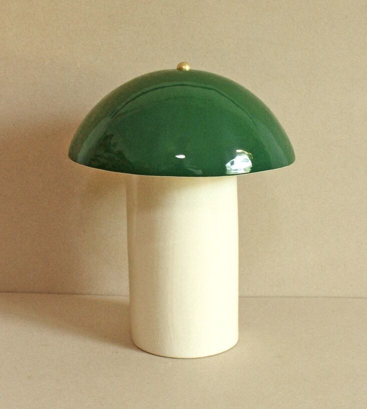 A mushroom-shaped ceramic lamp with a reflective chrome glaze.