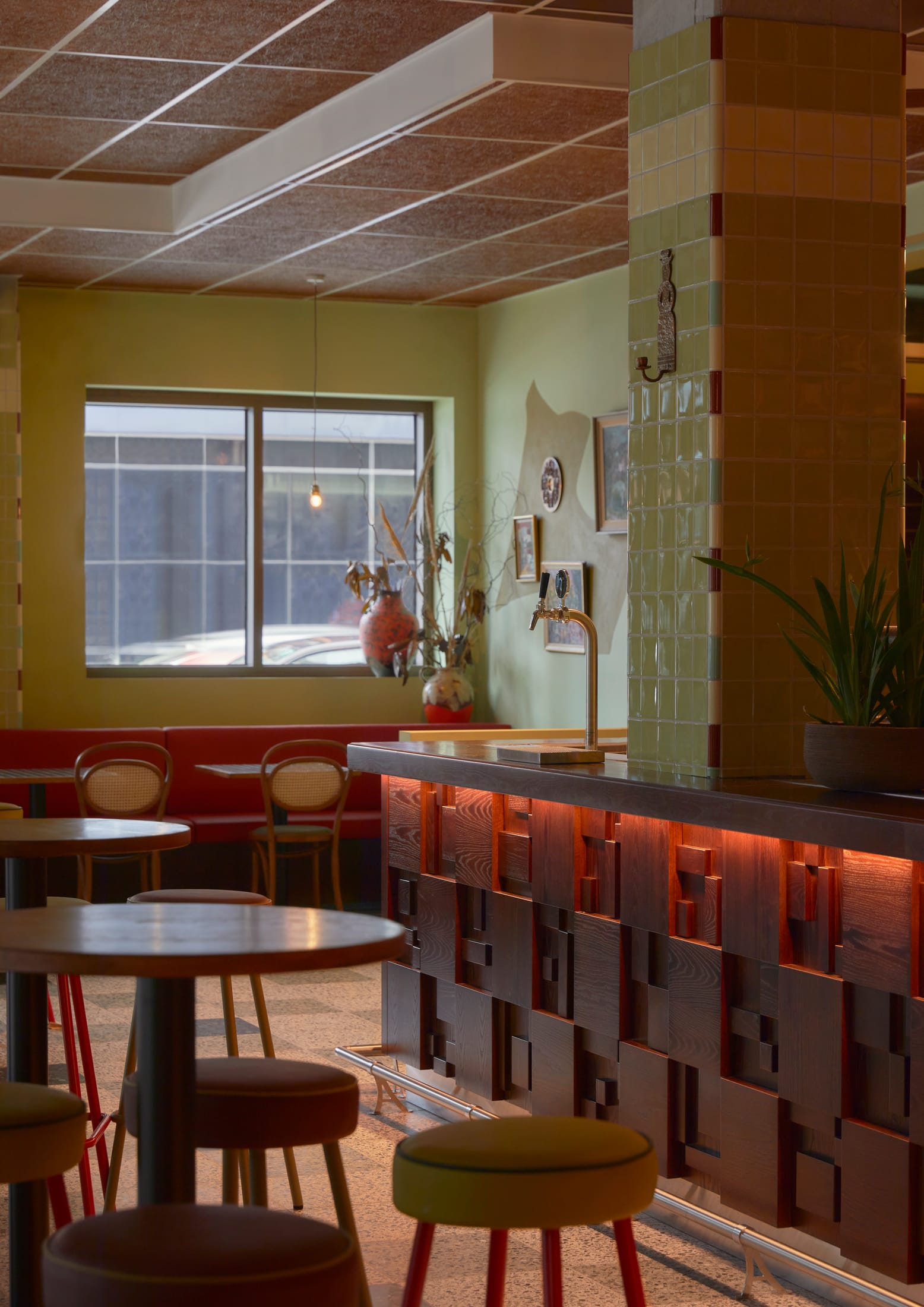 Dining area of Past/Port restaurant with caper and ochre tones.
