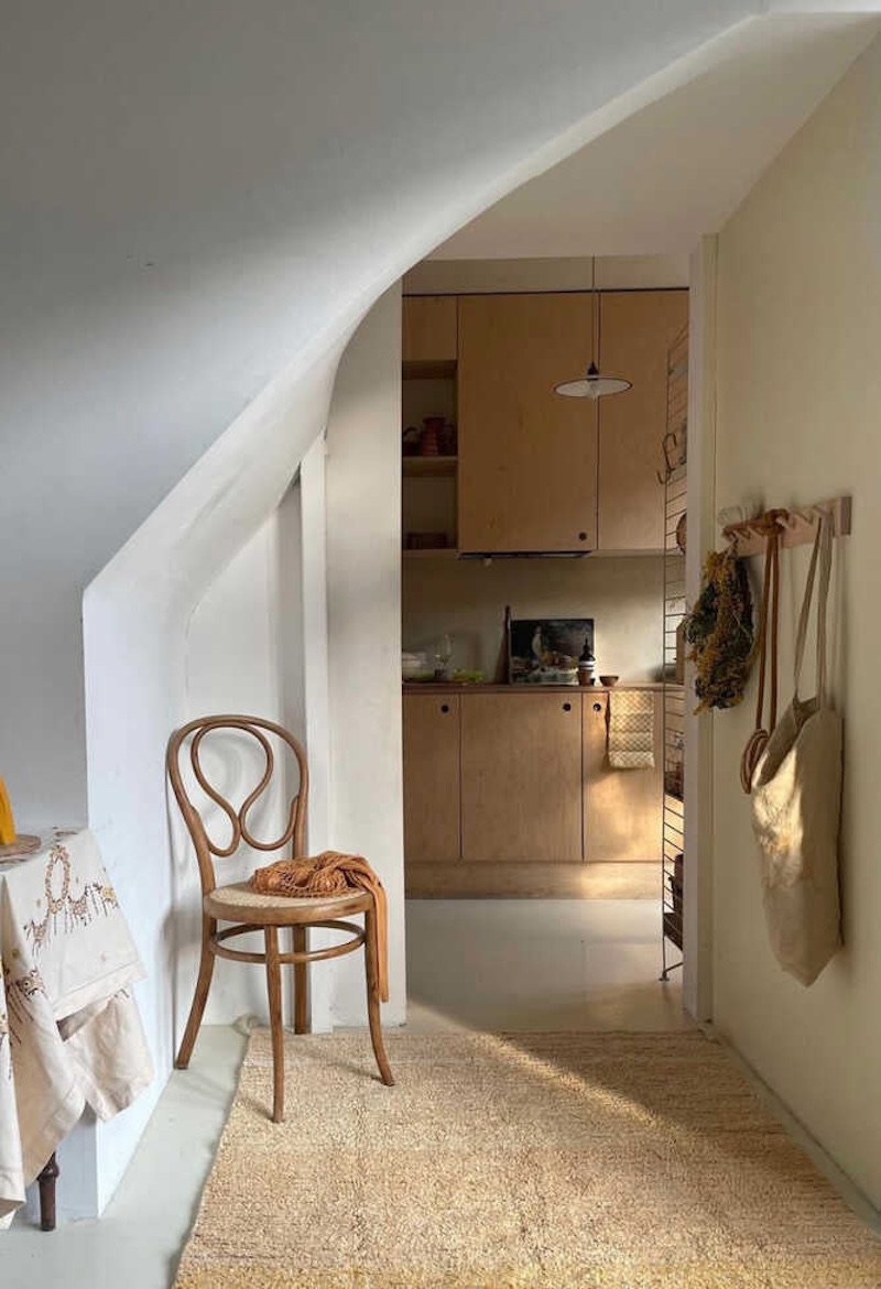 An amber-colored reversible washable cotton rug by Lorena Canals in a home setting.