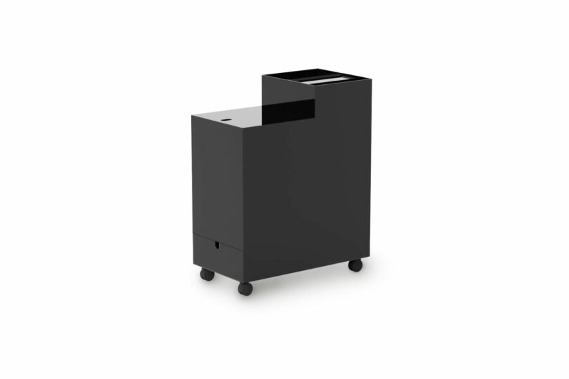 A black, tiered mobile storage cart showing different levels of open and closed storage.