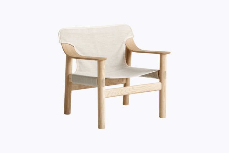 A HAY Bernard Lounge Chair featuring heavy-duty canvas and a solid oak frame.