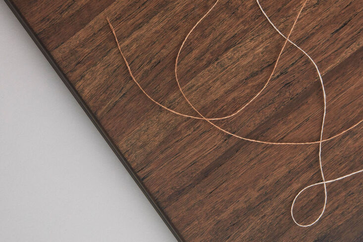 Close-up of vertical-grained bamboo kitchen cabinets in a dark Rye finish.