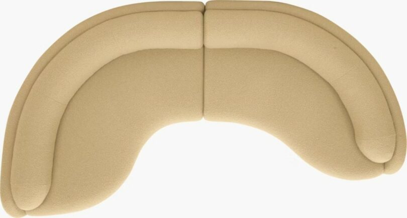 Overhead view of a two-piece curved sectional sofa showing its rounded edges and soft silhouette.