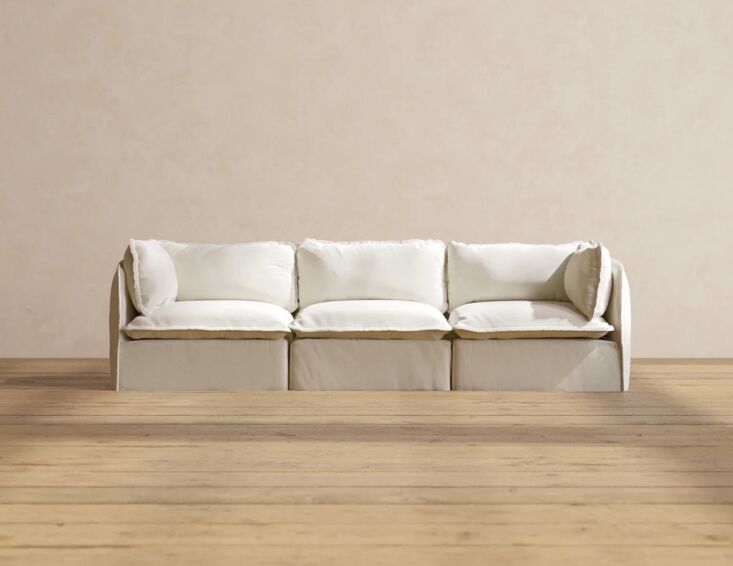 A low-profile washable sofa in an eggshell tone.