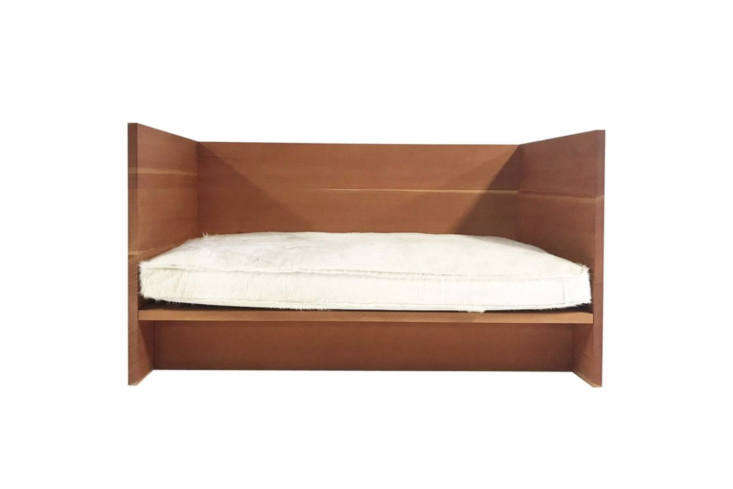 The Donald Judd Single Day Bed 32 in natural wood, showcasing extreme minimalist design.
