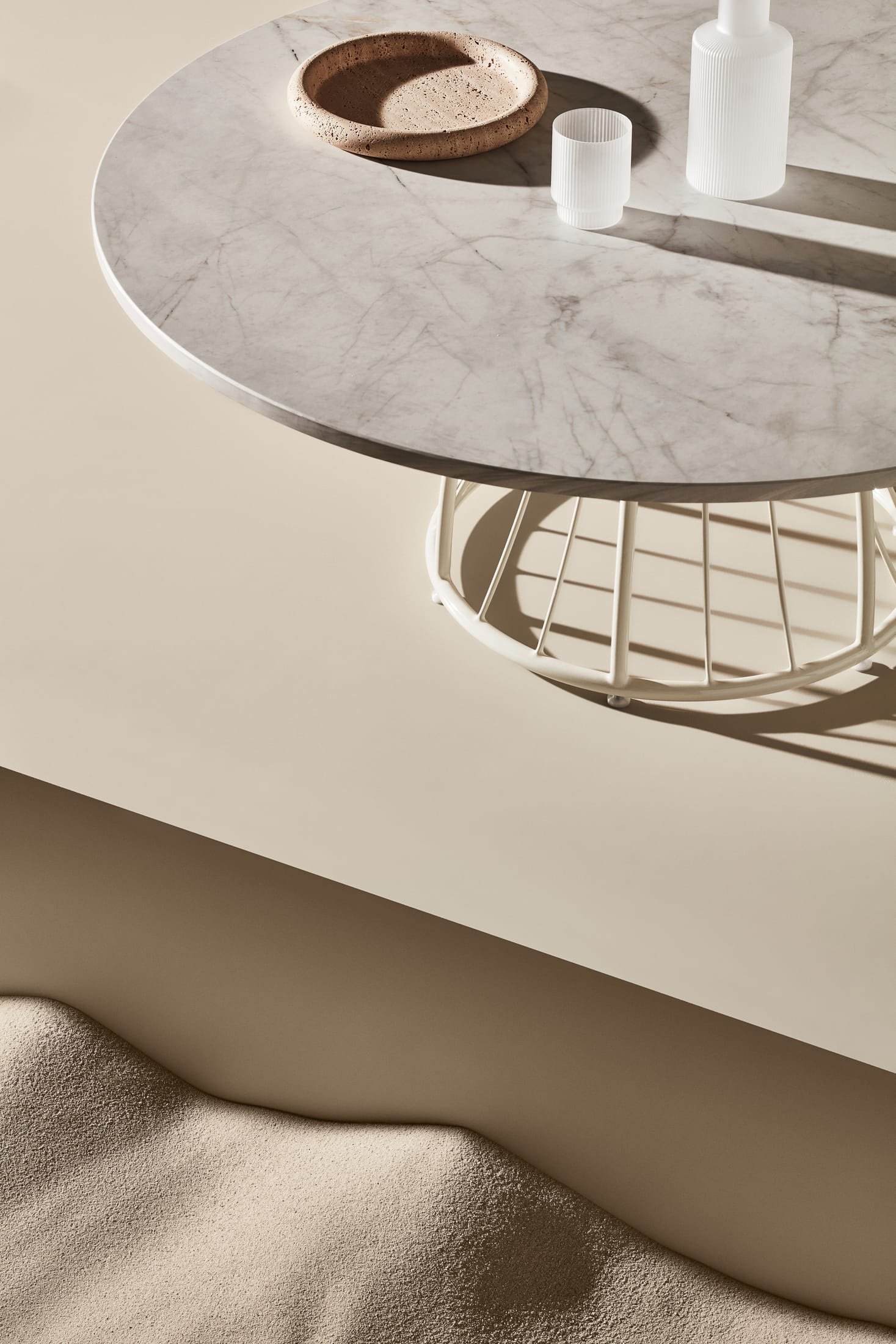 A low-angle shot of a lattice table base showing the intricate shadows cast on the floor.
