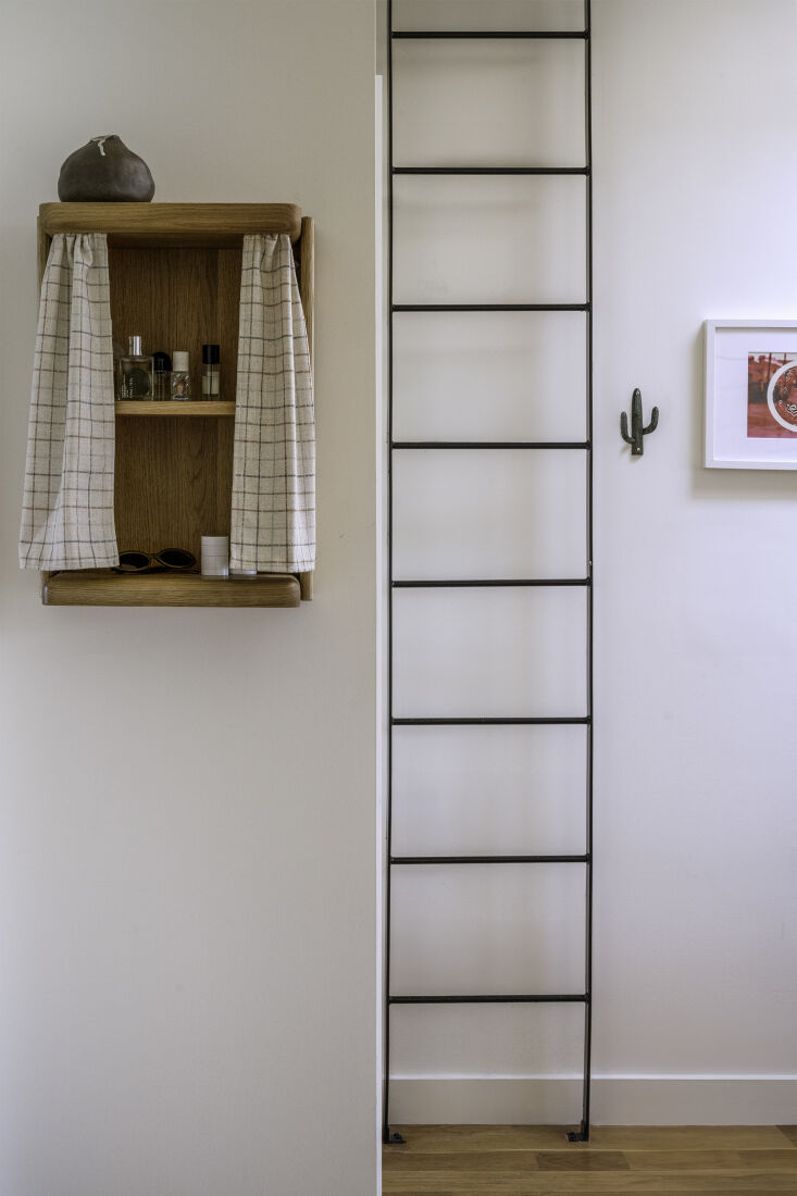 The Nook Curtain Table mounted to a wall as a floating shelf without legs.