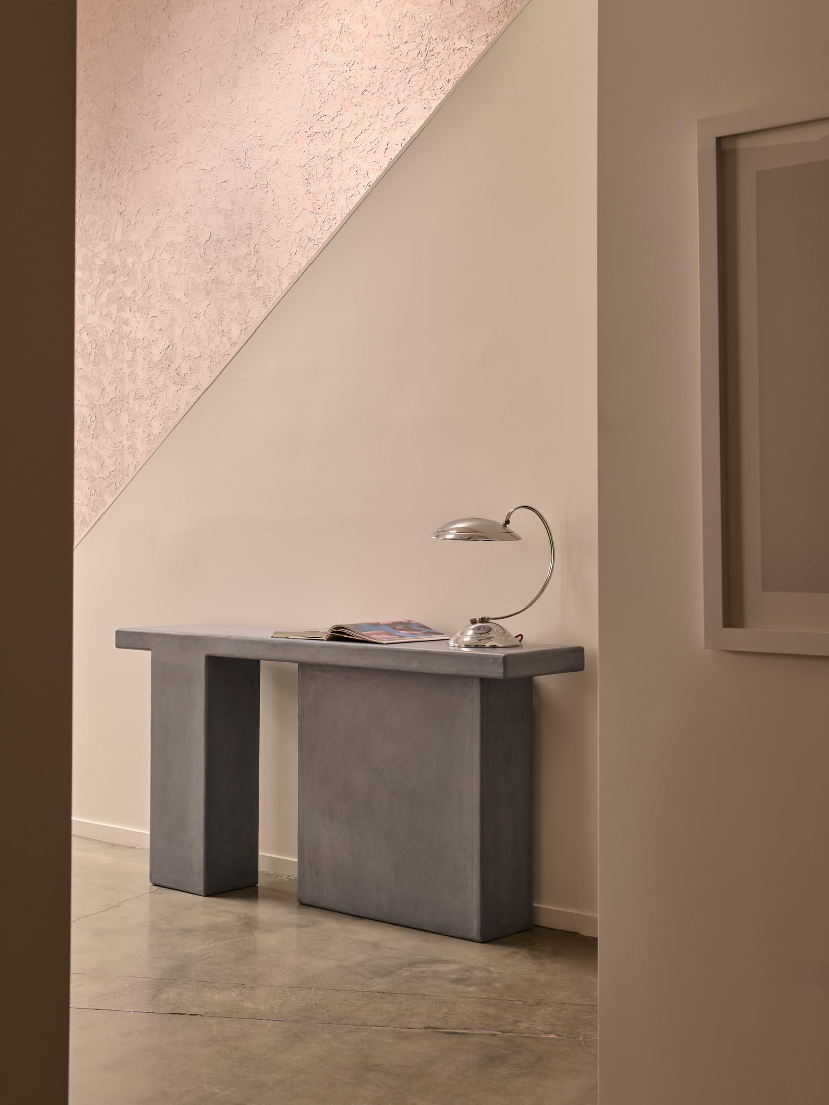 A group of sculptural plinths and tables in varying organic shapes and heights.