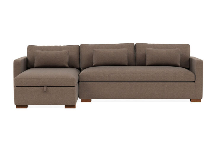The Interior Define Charly sectional with a left-side storage chaise configuration in a modern apartment.