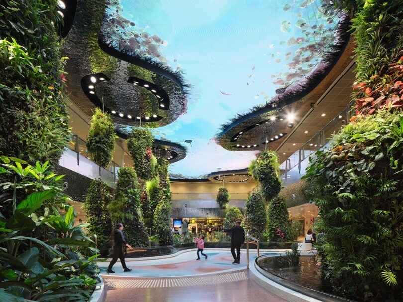 Lush indoor vertical gardens with reflective surfaces and a digital waterfall design.
