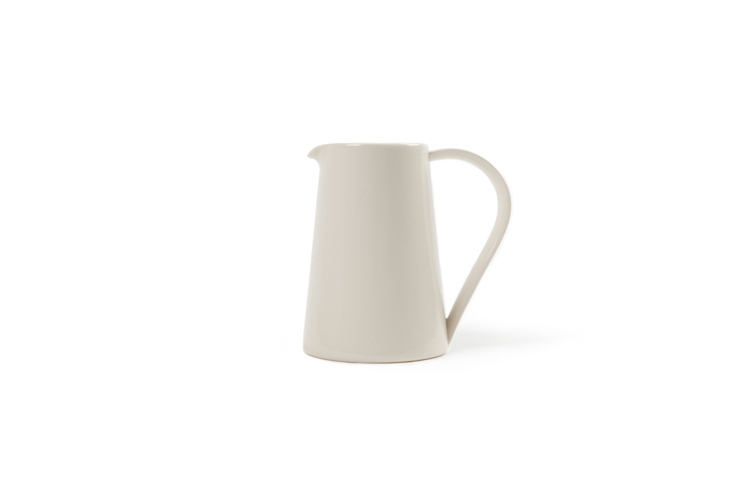 A mid-century style pitcher with a natural, matte ceramic finish.